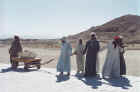 Laborers pulling stones for restoration work