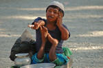 Deformed man singing in Nainital, India