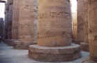 Hieroglyphs on the stone pillars.